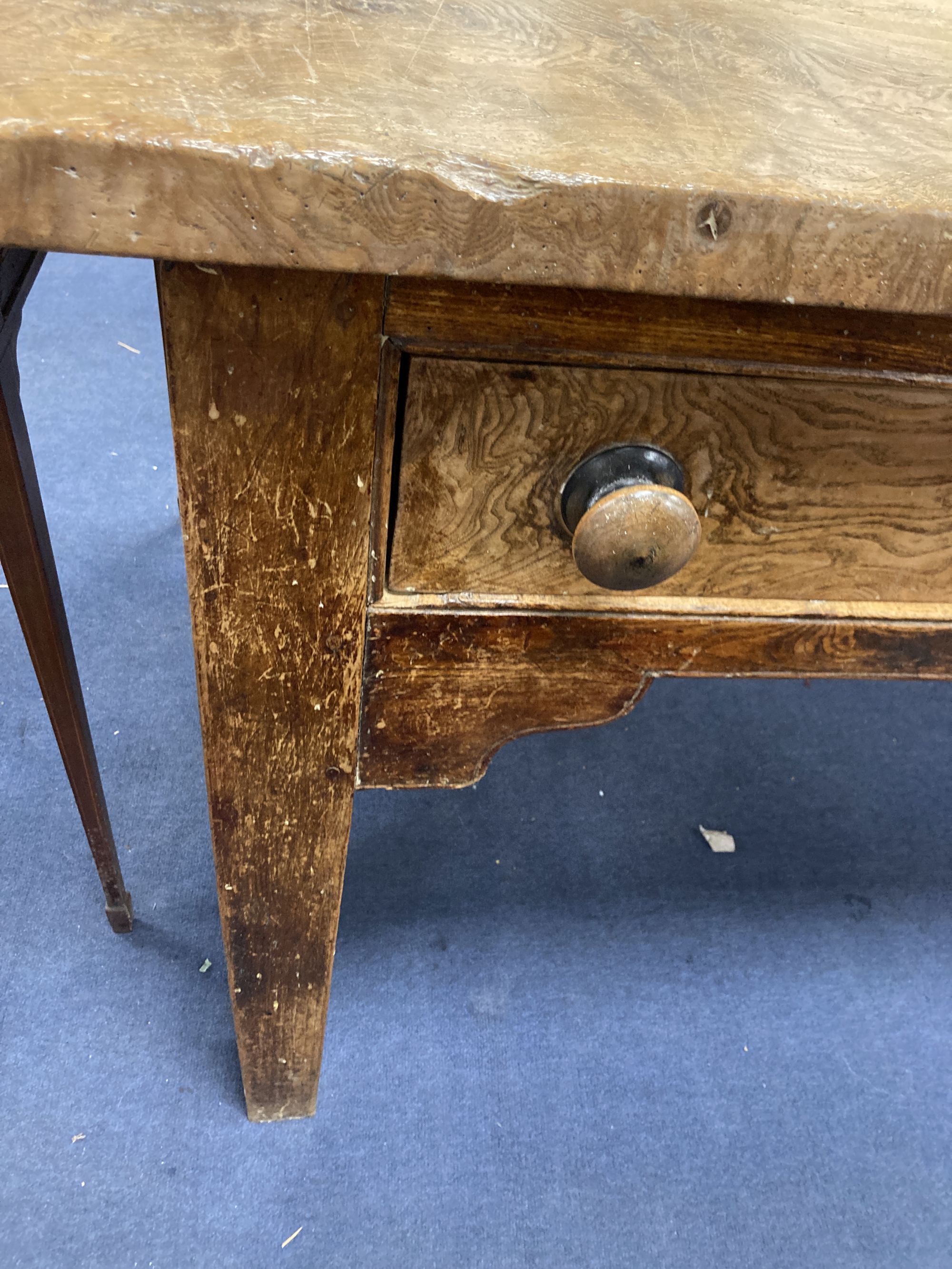 A large 19th century elm kitchen table fitted three drawers, length 227cm, width 88cm, height 80cm